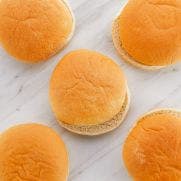 Sysco Essentials 4 inch Unseeded Burger Buns 48x50 GM